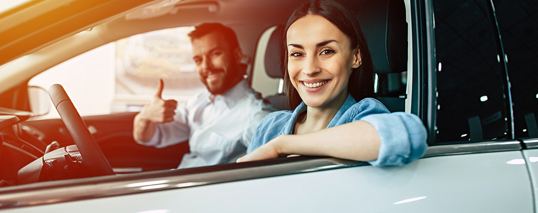 Couple in a new car.