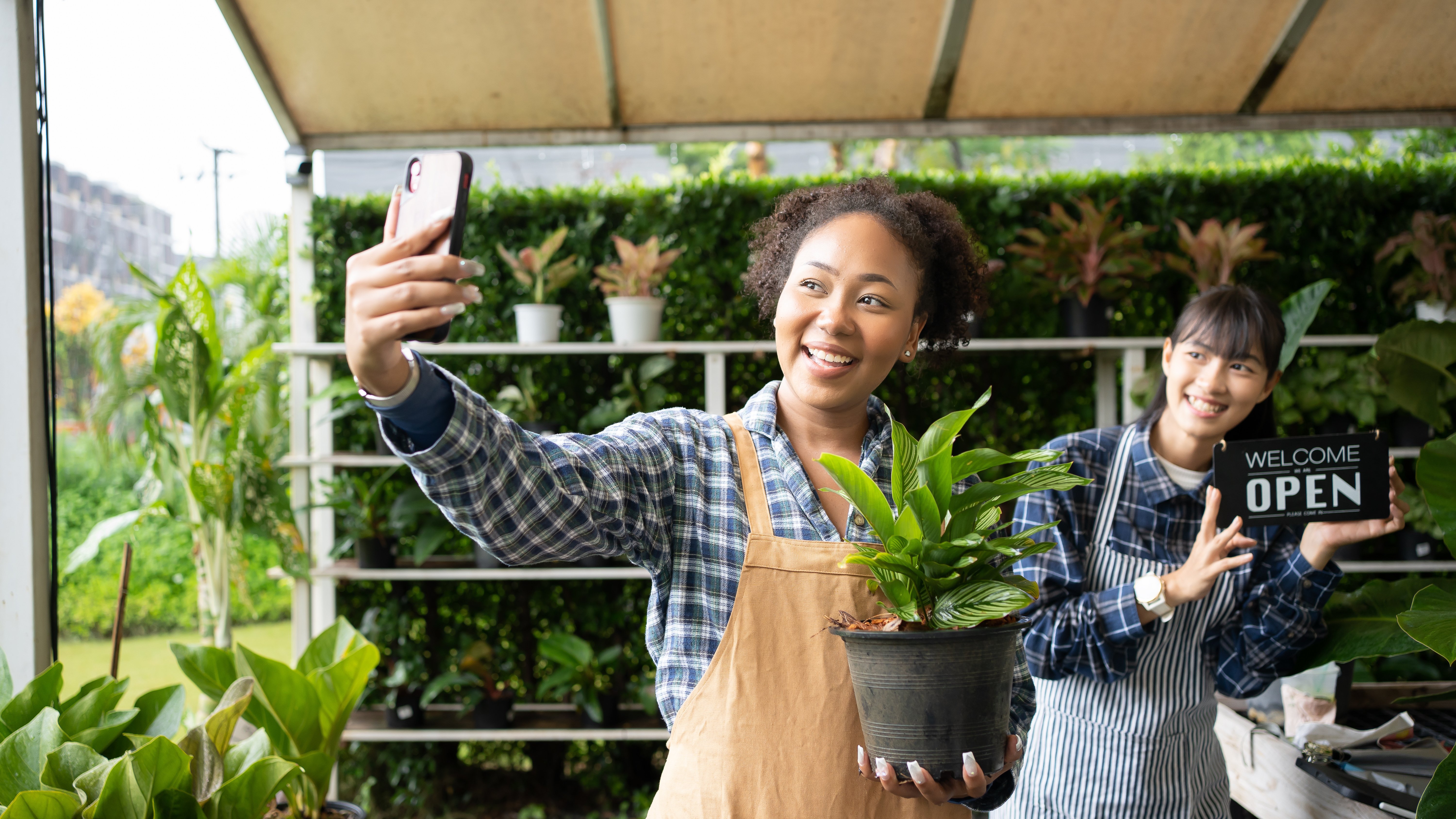 Two people working in a floral store.
