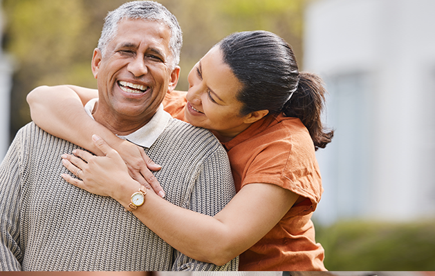 Happy mature couple outdoors.