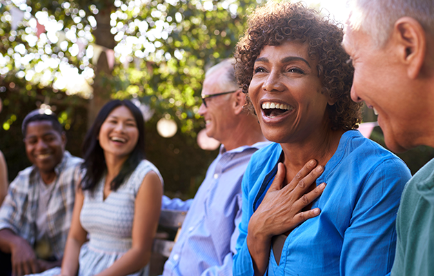 Friends laughing at a gathering.