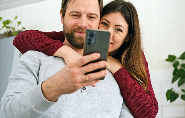 Couple looking at cell phone