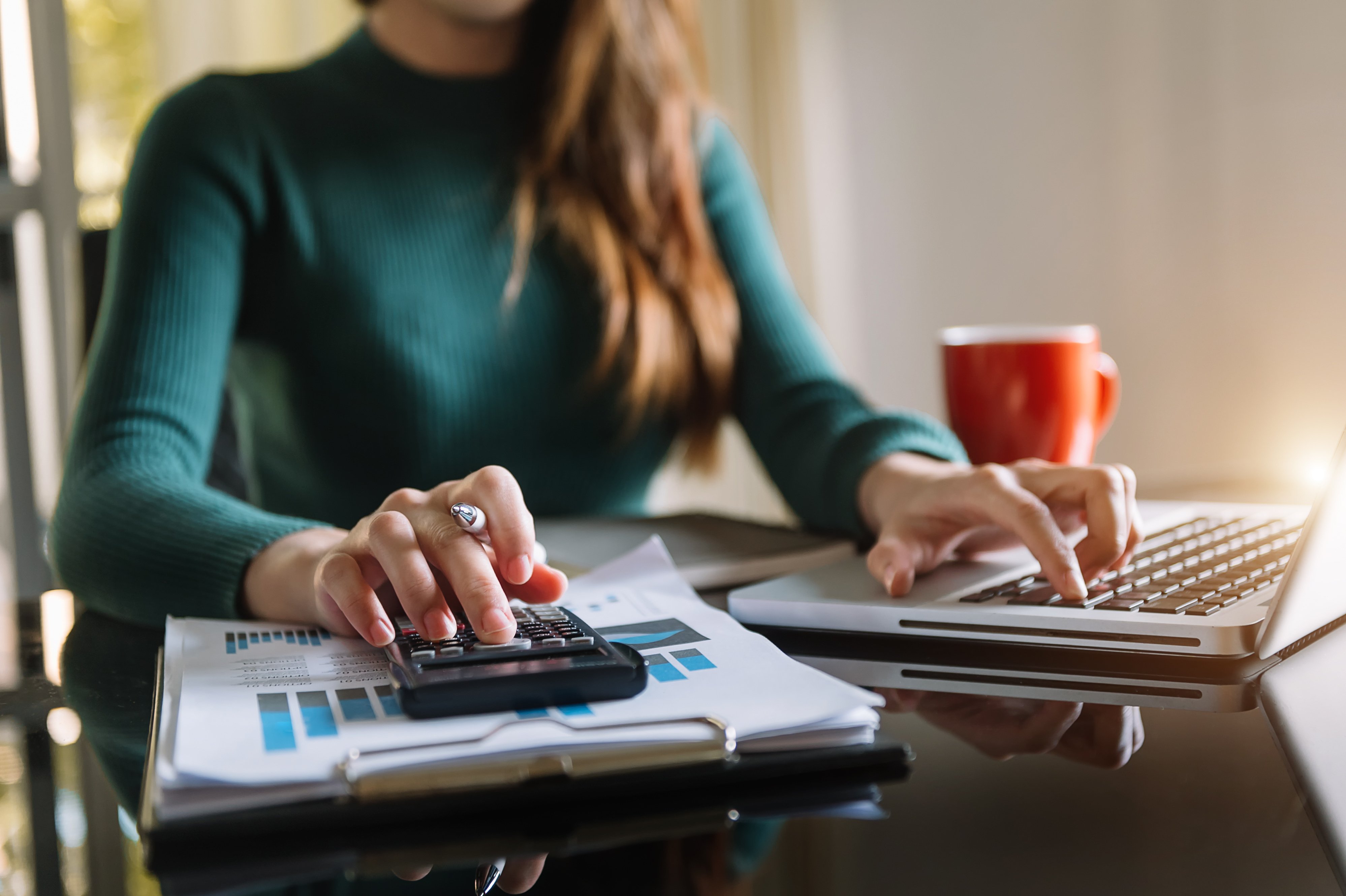 Woman working at a desk.